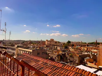 a view of a city from the roof of a building at Cavour Urban Rooms by GHOR in Rome