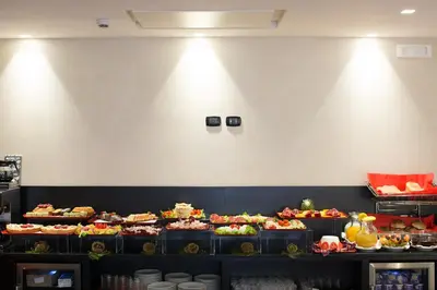 a buffet line with many different types of food at Floris Hotel in Rome