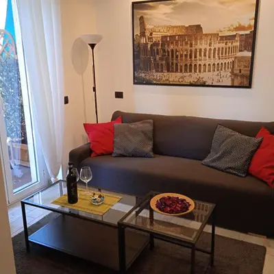 a living room with a couch and a table at Vatican Break Home in Rome