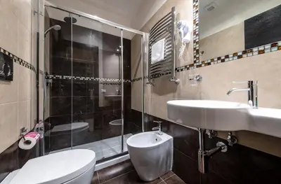 a bathroom with a toilet and a sink and a shower at Mia Resort in Rome