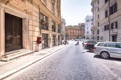 a city street with cars parked on the side of the road at Mia Resort in Rome