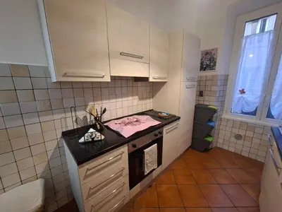 a small kitchen with a stove and a sink at Athena's Apartment in Rome