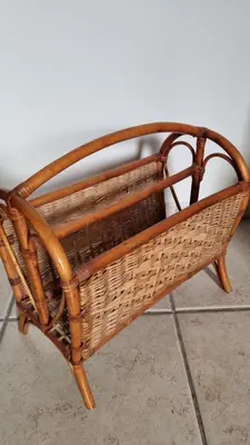 a wicker bench sitting on top of a floor at Studio della Pace, Classy & Charming - RENOVATED in Rome