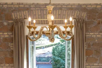 a chandelier hanging in front of a window at Kings Home In Rome in Rome