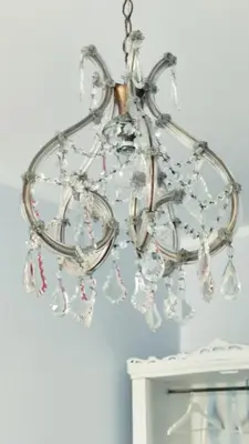 a glass chandelier hanging from a ceiling at Garbatella Chippendale Apartment in Rome