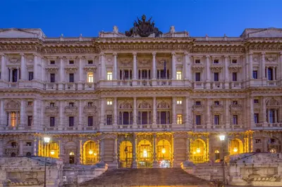 a large building with stairs in front of it at The Shell Rome Suite in Rome