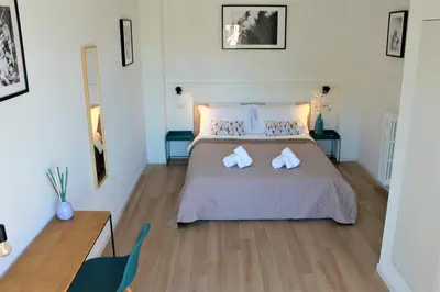 a bedroom with a bed with two towels on it at VATICAN APARTMENT MELORIA in Rome