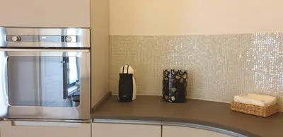 a kitchen with a counter top with a microwave at Luxury House Colosseo in Rome