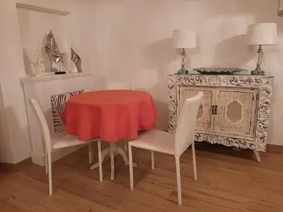 a dining room with a red table and chairs at Navona Best House in Rome