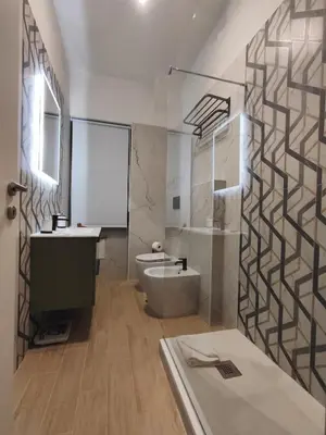a bathroom with a toilet and a sink at Chroma Italy - Doctor House in Rome