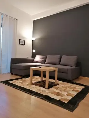 a living room with a couch and a coffee table at Chroma Italy - Doctor House in Rome
