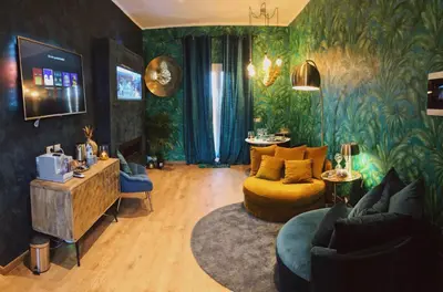 a living room with a couch and a chair at Rooftop Colosseo - Roma d'Amore in Rome