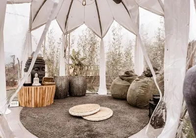 a room with a tent with a table and chairs at Rooftop Colosseo - Roma d'Amore in Rome