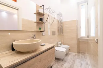a bathroom with a sink and a toilet at Museum Inn - Una finestra sui Musei Vaticani in Rome