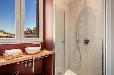 a bathroom with a shower and a sink at CORNER211 in Rome