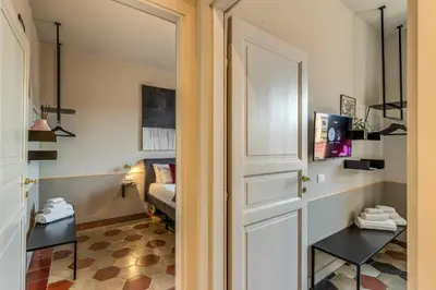 a door leading into a room with a couch at CORNER211 in Rome