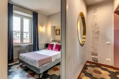a bedroom with a bed and a window at CORNER211 in Rome