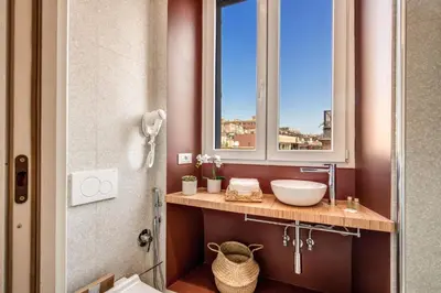 a bathroom with a sink and a window at CORNER211 in Rome
