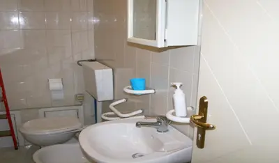 a bathroom with a sink and a toilet at Montebello - Julia Apartment in Rome