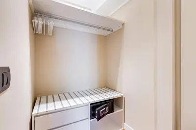 a small kitchen with a small refrigerator in a room at Frattina High-end apt in Rome