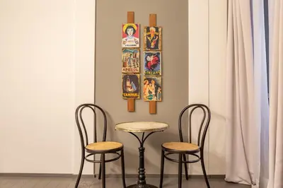 a table and two chairs in a room at Spanish Steps DeLuxe Apartment in Rome