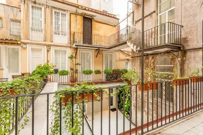 a balcony of a building with potted plants at Spanish Steps DeLuxe Apartment in Rome