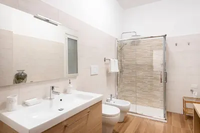 a bathroom with a sink and a toilet and a shower at B&B Il Dogandiere in Rome