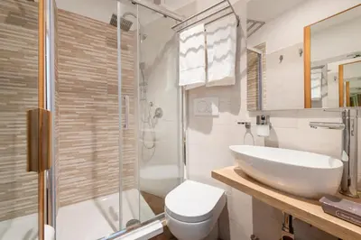 a bathroom with a sink and a toilet and a shower at B&B Il Dogandiere in Rome