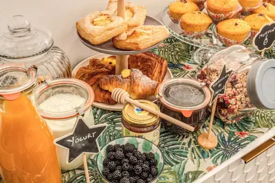 a table with pastries and other foods on it at Trastevere 2.0 in Rome