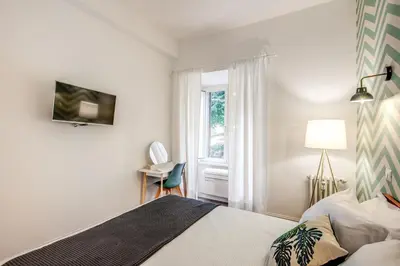 a bedroom with a bed and a window at Trastevere 2.0 in Rome