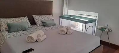 a bedroom with a bed with towels on it at Clementinam Suite Colosseum in Rome