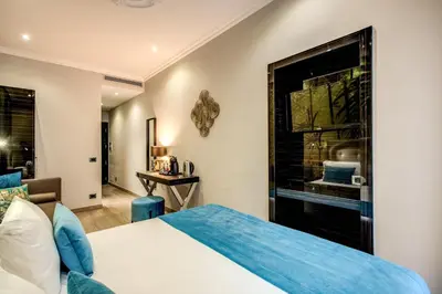 a bedroom with a bed and a window at Relais De La Poste in Rome