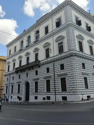 a large white brick building on the side of a street at Novembre 152 Apartment in Rome