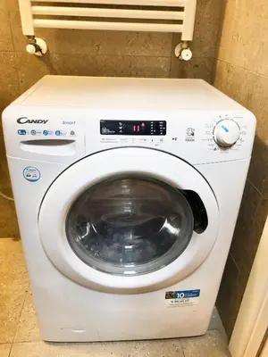 a washer and dryer in a room at Novembre 152 Apartment in Rome