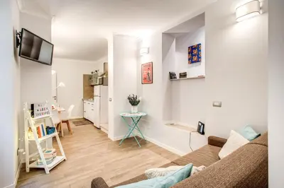 a living room with a couch and a table at Novembre 152 Apartment in Rome