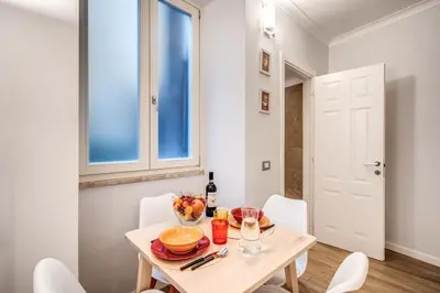 a small dining room with a table and chairs at Novembre 152 Apartment in Rome