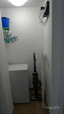 a room with a machine in the corner of a bathroom at Casa di Rosita in Rome