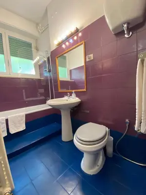a bathroom with a toilet and a sink and a tub at Suite Marilyn - Flaminio - Olimpico - Auditorium in Rome