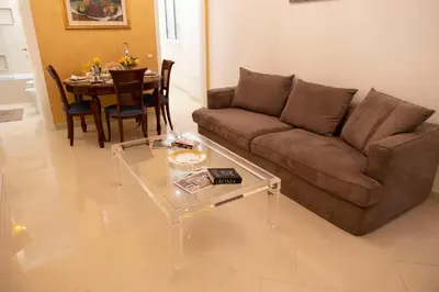 a living room with a couch and a table at Cathy's Luxury Home in Rome