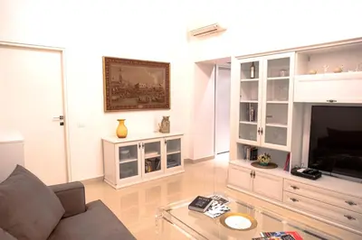 a living room with a couch and a tv at Cathy's Luxury Home in Rome