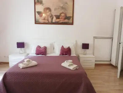 a bedroom with a bed with two towels on it at Fantasie in Trastevere in Rome
