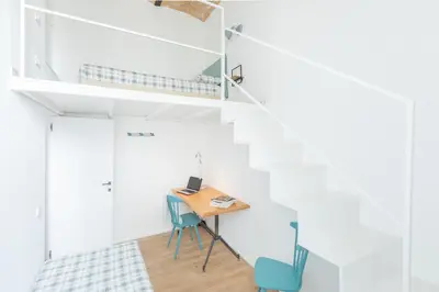 a small room with a desk and a bunk bed at Mini appartamento Colosseo in Rome