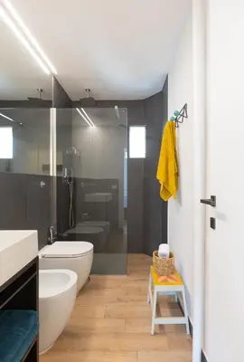 a bathroom with a tub and a toilet and a sink at Mini appartamento Colosseo in Rome