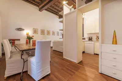 a kitchen and dining room with a table and chairs at Unique opportunity to live in a Renaissance palace - AC/WI-FI in Rome