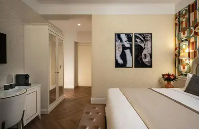 a hotel room with a bed and a bathroom at Leonardo Boutique Hotel Rome Monti in Rome