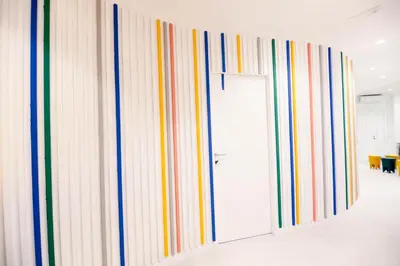 a row of mirrors on a wall in a room at O.Effe. Suites / Vatican in Rome