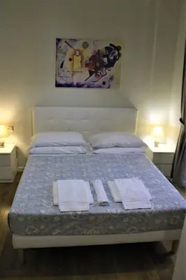 a bedroom with a bed with towels on it at The Castle Inside Rome in Rome