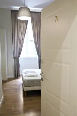 a door in a room with a bed and a window at The Castle Inside Rome in Rome