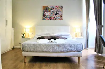 a bedroom with a bed with two towels on it at The Castle Inside Rome in Rome