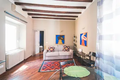 a living room with a couch and a table at Colosseum nest in Rome